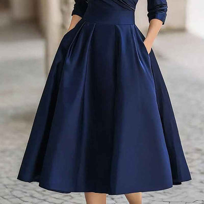 Robe mi - longue élégante pour femme à col en V croisé, jupe évasée et poches — tenue chic de printemps/été - parlezmode.com